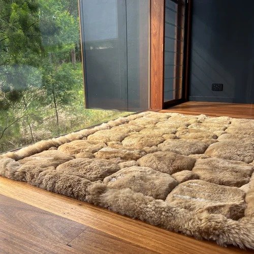 Alpaca hide with fleece, and the backing is fabric/sateen